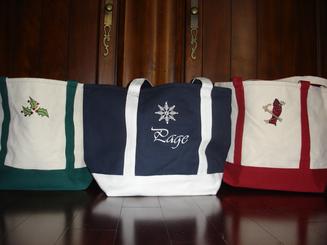Embroidered canvas tote in wonderful Holiday colors!  Great gift with a 7" wide bottom to hold a lot of Holiday gifts.