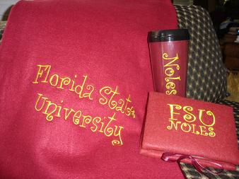 Graduation Gift set includes a blanket, photo album and tumbler personalized for you.
