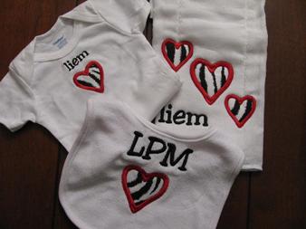 Onsie, bib and burp cloth set all personalized or monogramed.